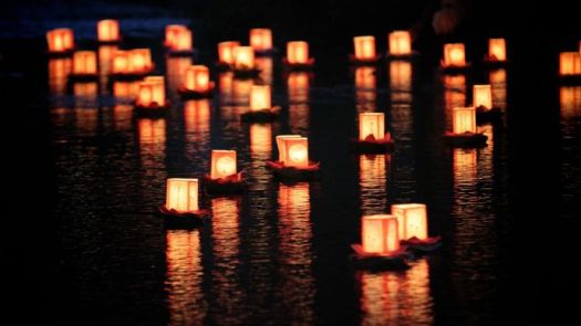 candle lights on river